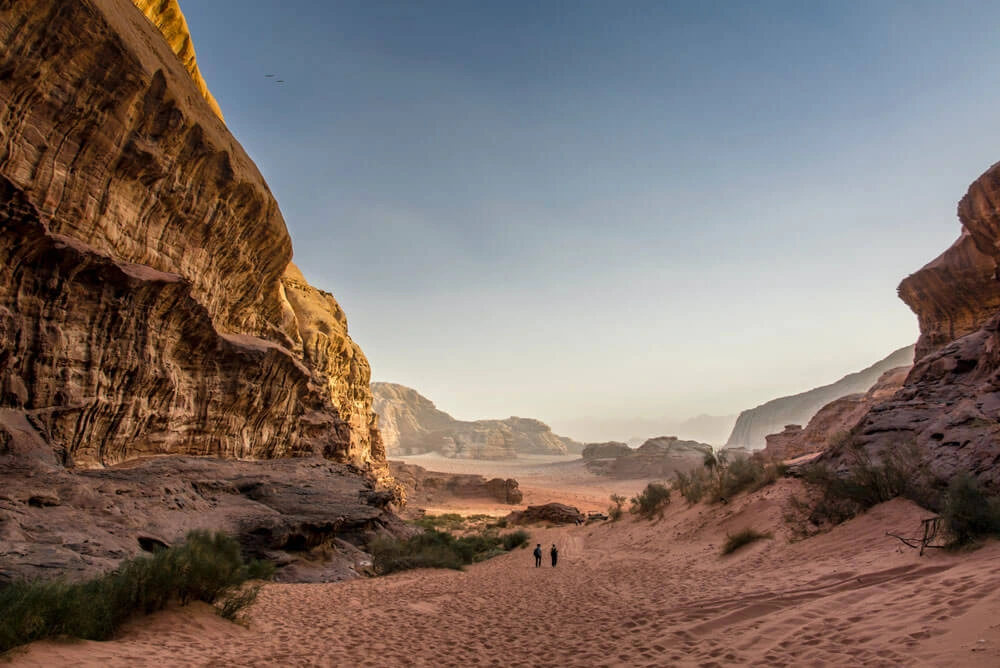 The front of Wadi Rum Desert in Jordan surrounded by rocks and blue sky in horizon 